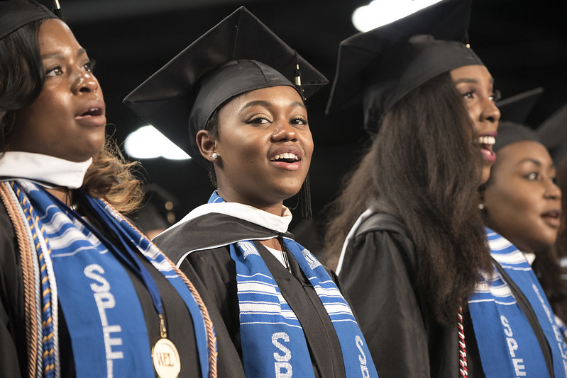 Spelman college graduate cheering in crowd