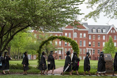 Graduates walking past the Spelman College Arch