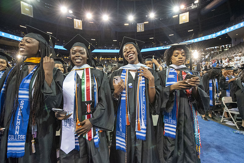 Spelman College Commencement 2022 Graduates smiling at ceremony.