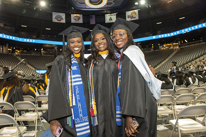 Spelman College Commencement 2022 - Three graduates posing together.