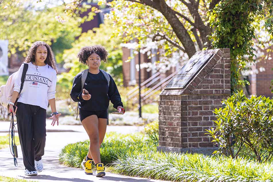 Two students walking together on campus