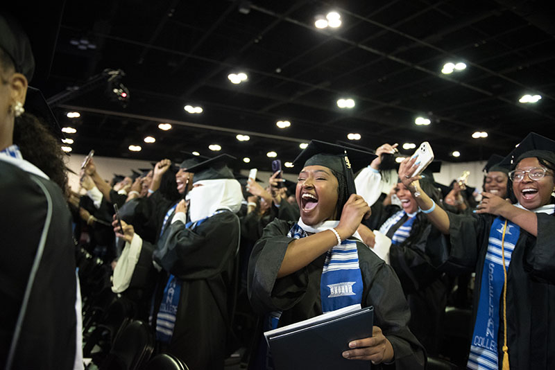 Spelman College - Commencement 2023 - Graduates cheering together.